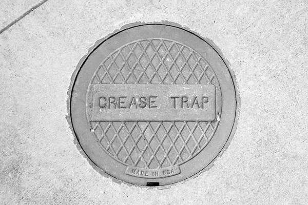 grease trap pumping helps prevent clogs, odors, and costly repairs in your commercial kitchen